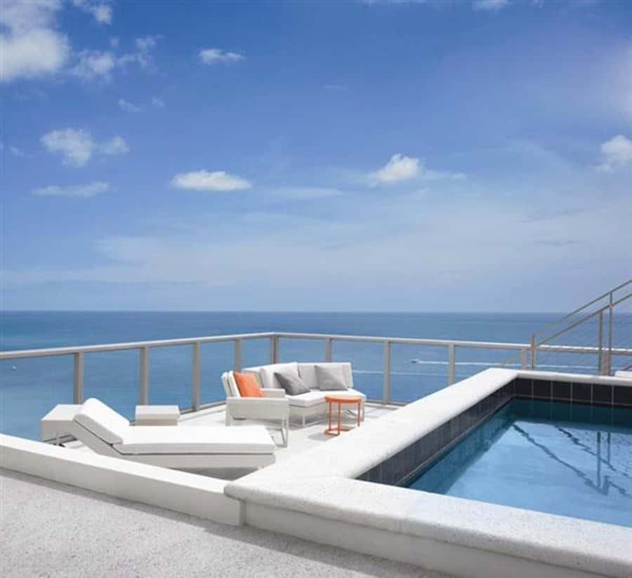 Serene Beach Swimming Pool Oasis Wallpaper