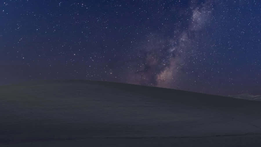 Serene Night Sky Illuminated By Dazzling Stars Wallpaper