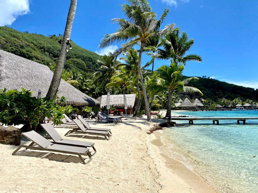 Serene Overwater Bungalows At Bora Bora Beach Wallpaper