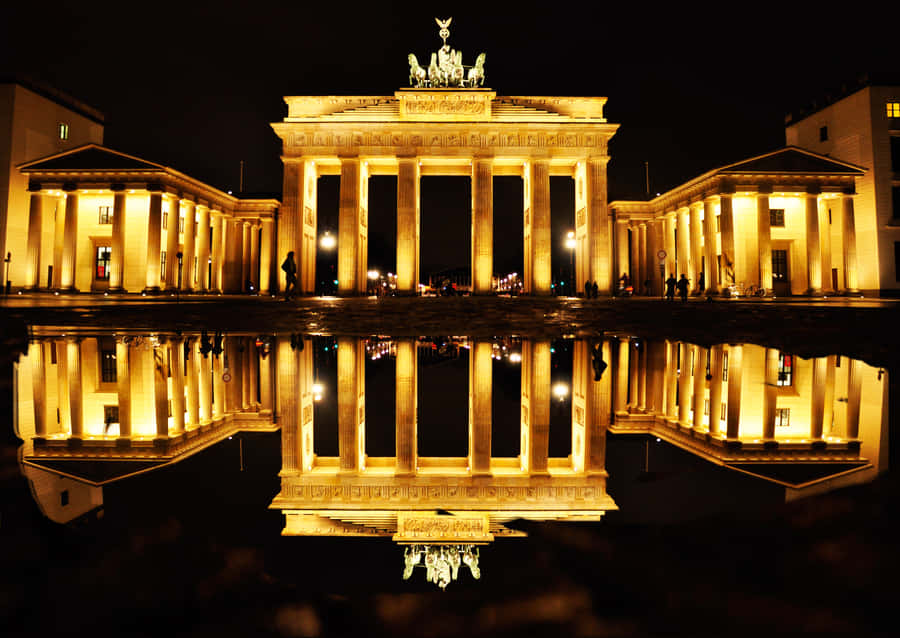 Serene Reflection Of The Brandenburg Gate Wallpaper
