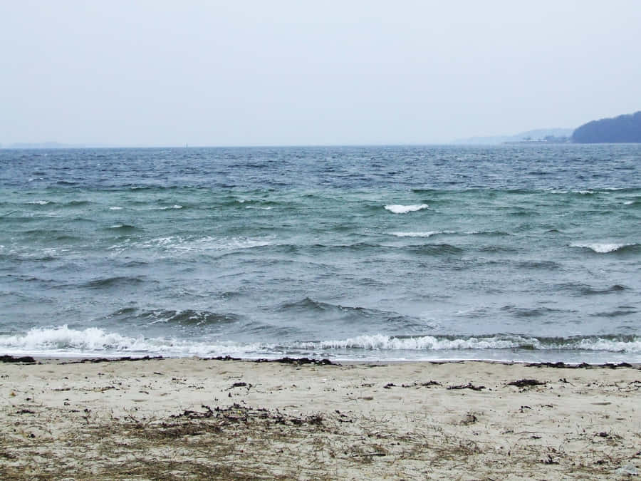 Serene Sea Breeze At Sunset Wallpaper