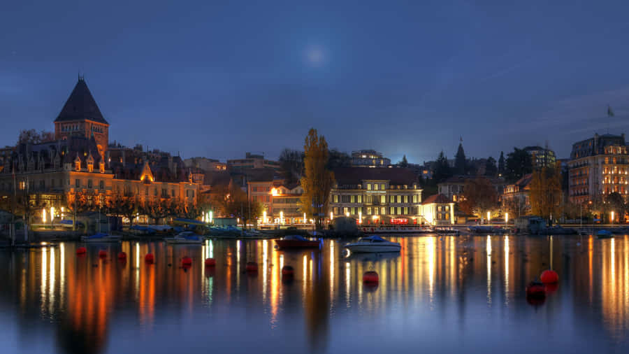 Serene Sunset Over The Picturesque City Of Lausanne, Switzerland Wallpaper