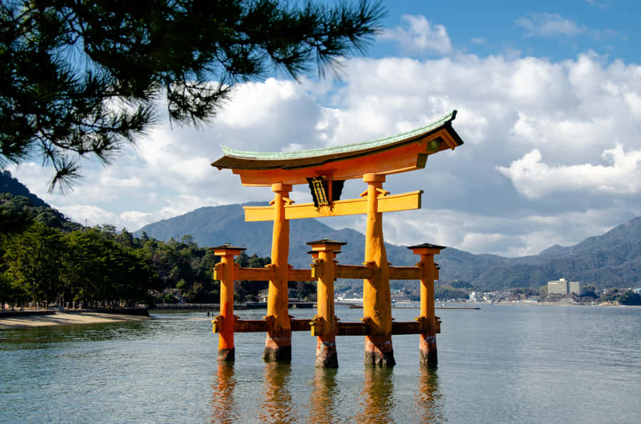 Serene Torii Gate By The Water Wallpaper