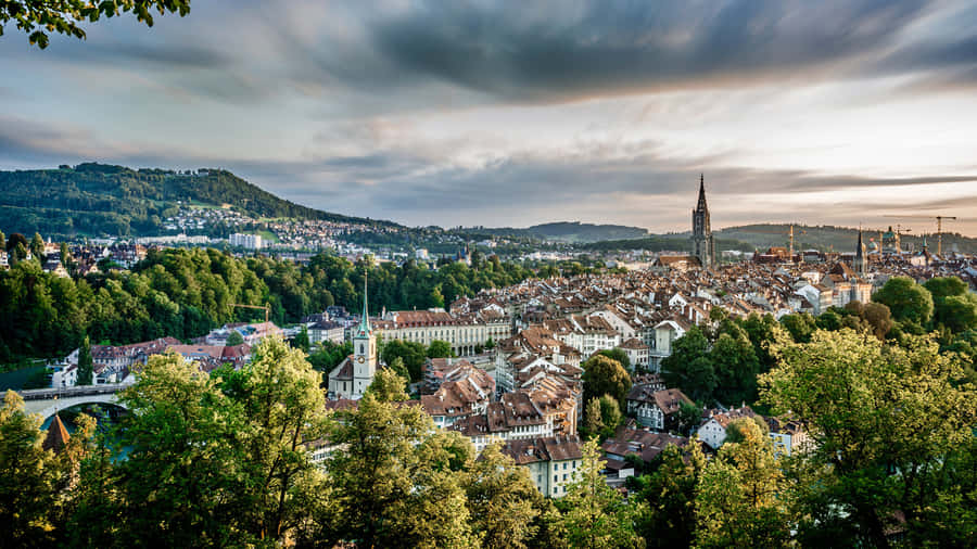 Serene View Of The Federal Palace Of Switzerland In Bern Against Sunset Sky Wallpaper