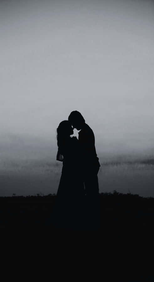 Shadowed Lovers Embrace Wallpaper