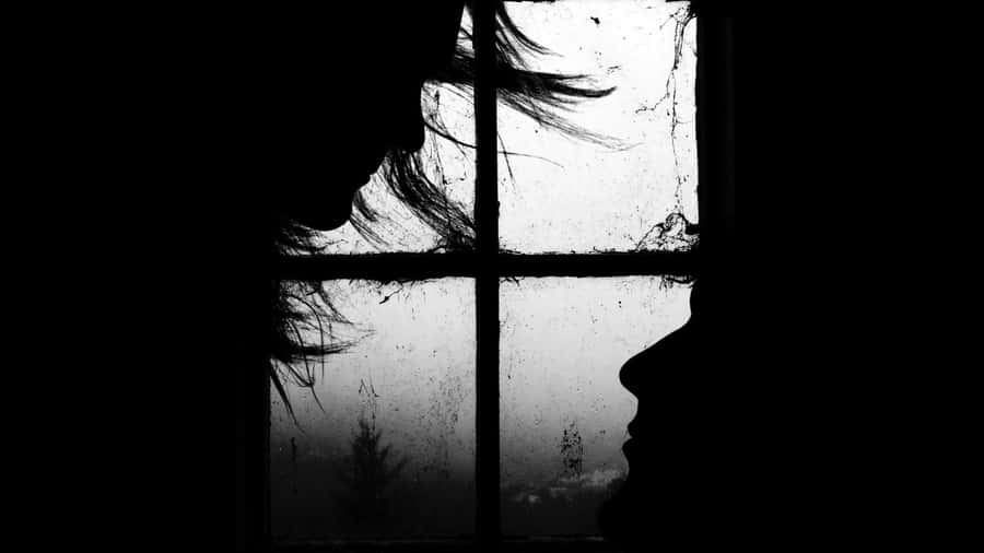 Shadowed Silhouettes Of Longing Wallpaper