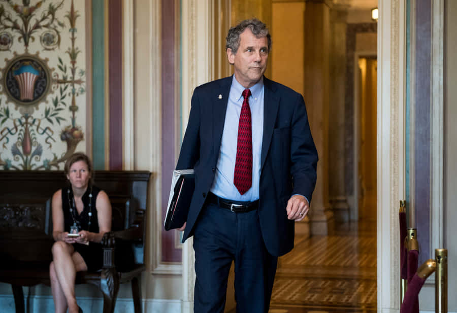 Sherrod Brown Entering His Office Wallpaper