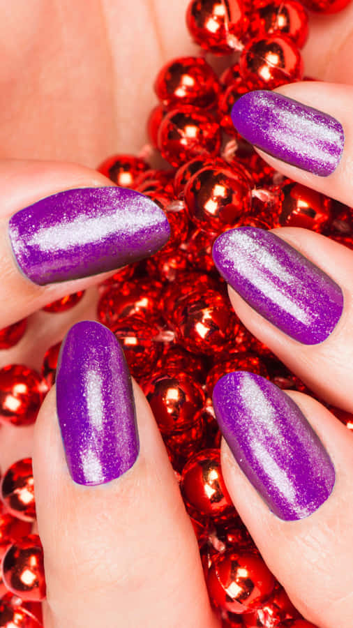 Shimmering Purple Manicurewith Red Beads Wallpaper