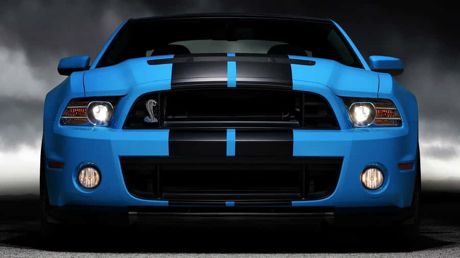 Shiny Blue Car Ready To Ride Wallpaper
