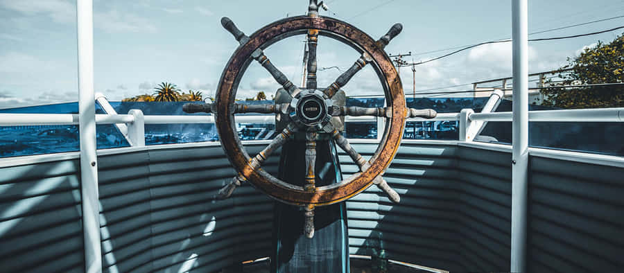 Ship's_ Wheel_and_ Deck_ View.jpg Wallpaper
