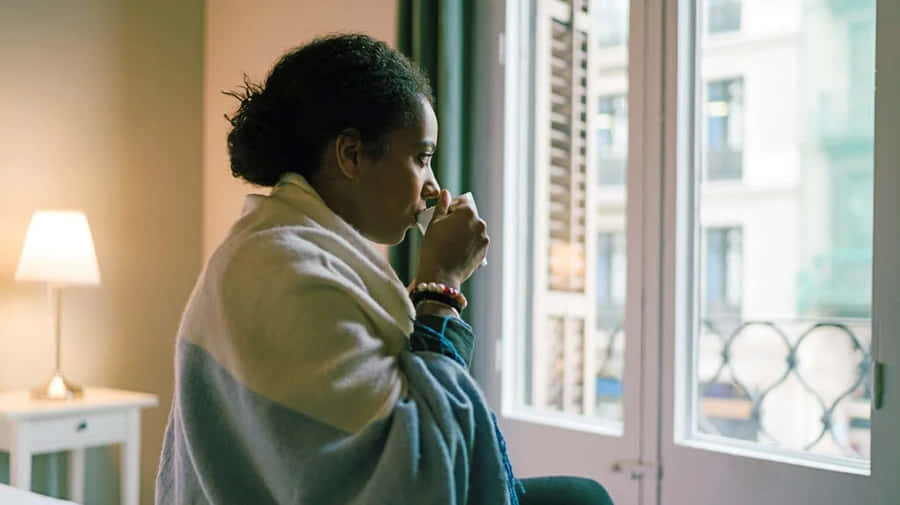 Shivering Woman Drinking Coffee [wallpaper] Wallpaper