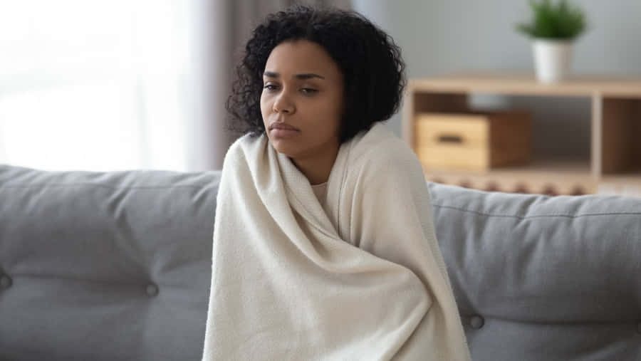 Shivering Woman Holding Blanket [wallpaper] Wallpaper