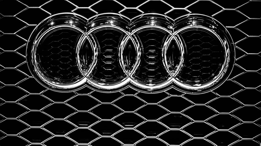 Silver Audi Car Emblem In Solid Black Wallpaper