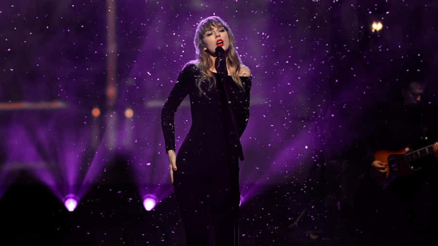 Singer_ Performing_ Under_ Purple_ Lights Wallpaper