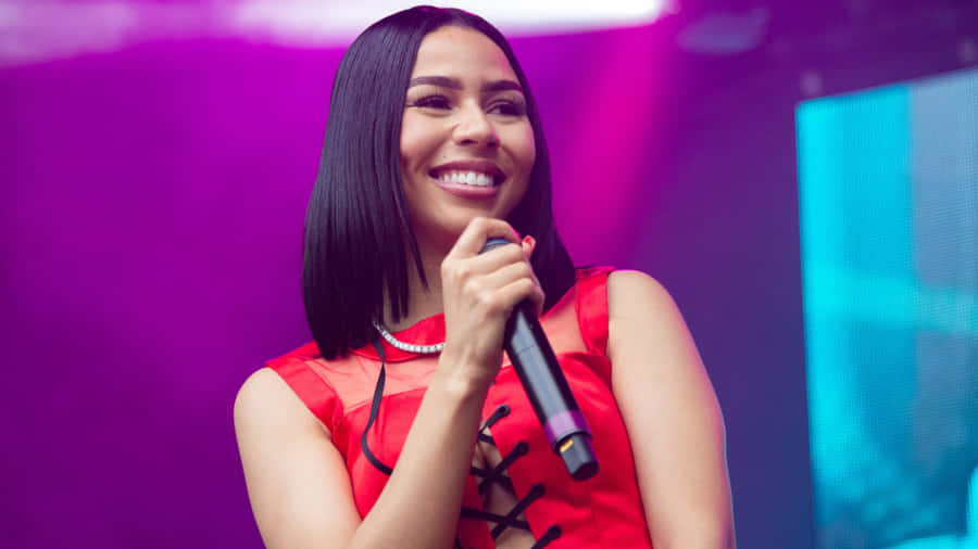 Singer Smiling On Stage.jpg Wallpaper