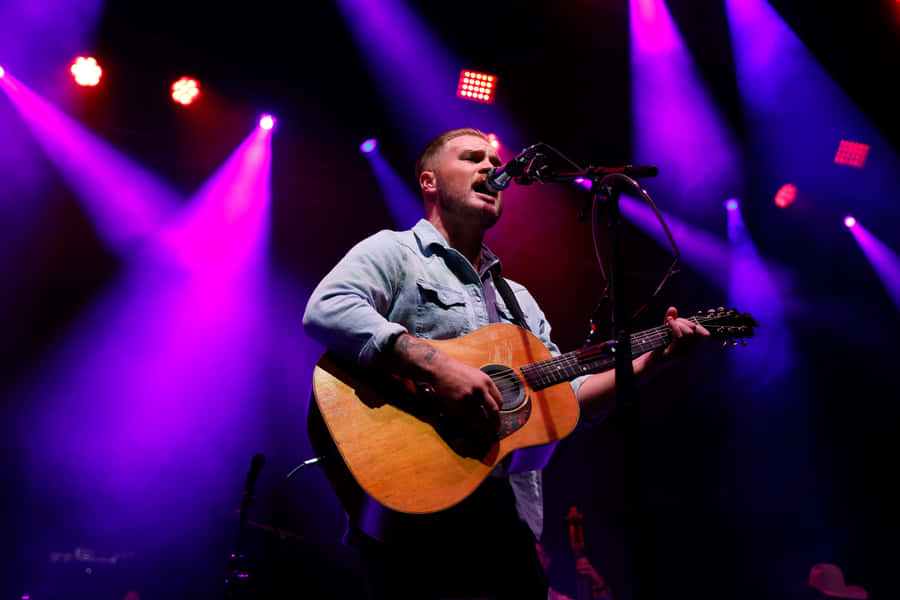 Singer Songwriter Performance Stage Lights Wallpaper
