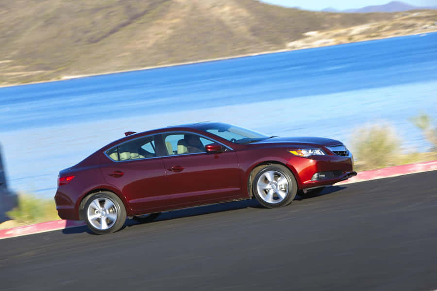 Sleek Acura Ilx On The Road In A Picturesque Landscape Wallpaper
