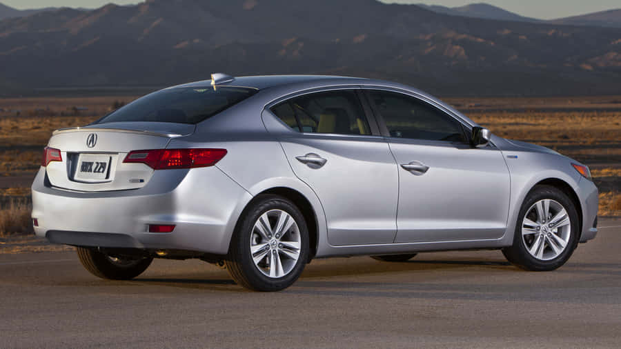 Sleek Acura Ilx Parked On A Scenic Mountain Road With A Picturesque Backdrop Wallpaper