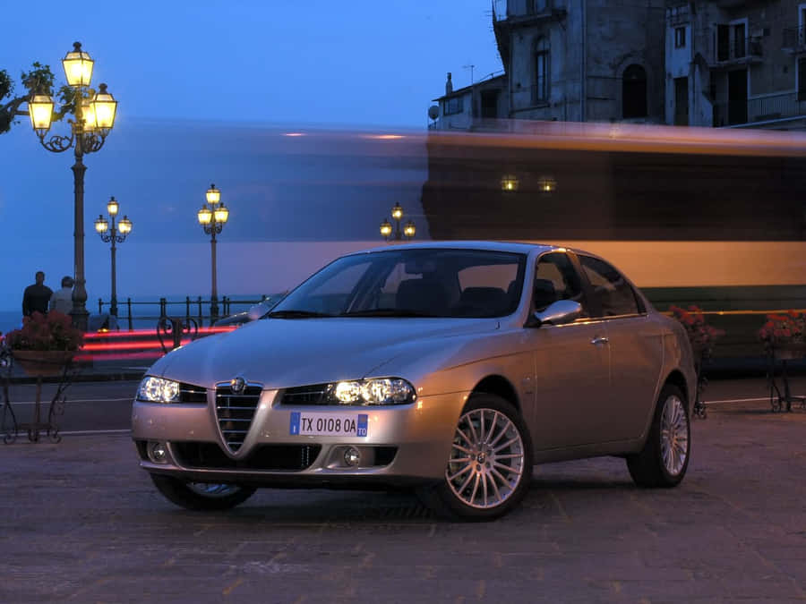 Sleek Alfa Romeo 156 On The Road Wallpaper