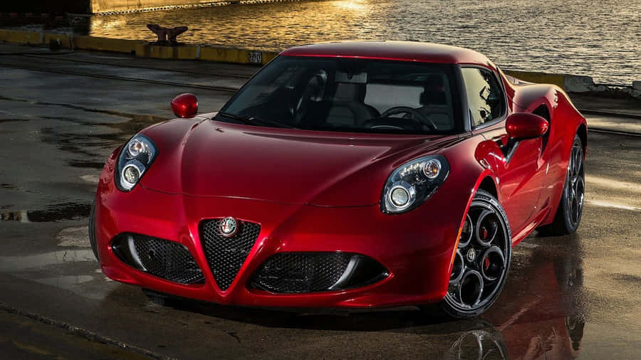 Sleek Alfa Romeo 4c Sports Car In Motion Wallpaper