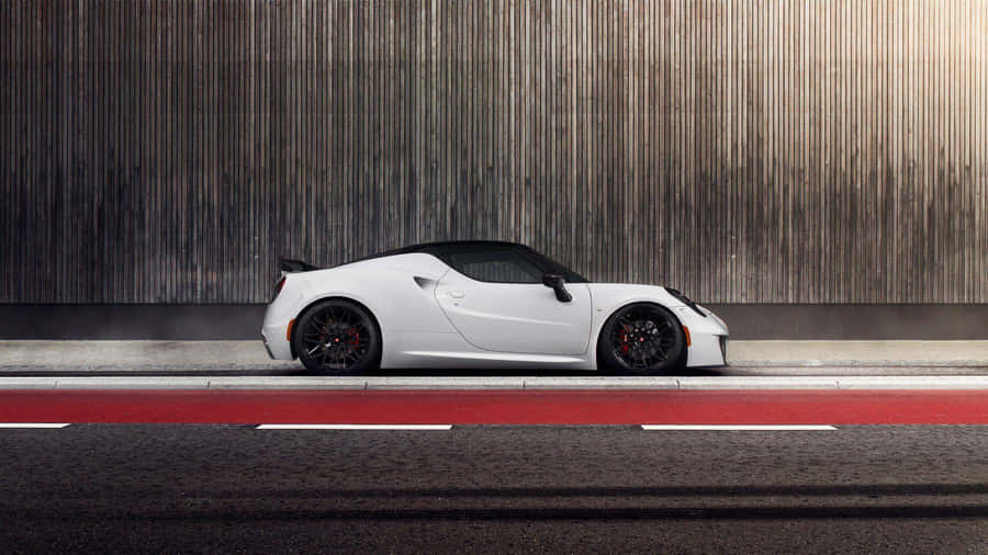 Sleek Alfa Romeo 4c Sportscar In Action Wallpaper