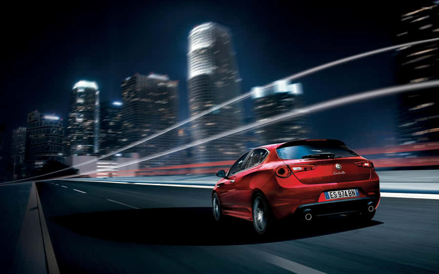 Sleek Alfa Romeo Giulietta In Action Wallpaper