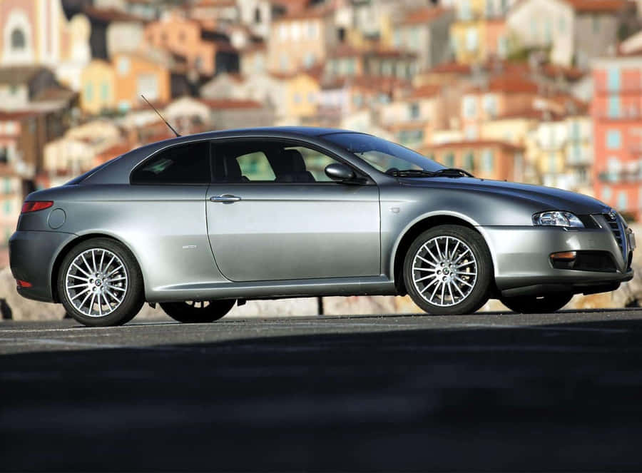 Sleek Alfa Romeo Gt On The Open Road Wallpaper