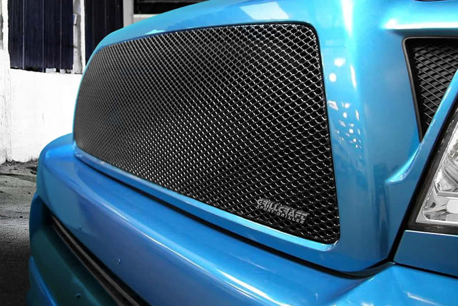 Sleek And Elegant Car Grill Dominating The Front Of A Luxurious Vehicle Wallpaper