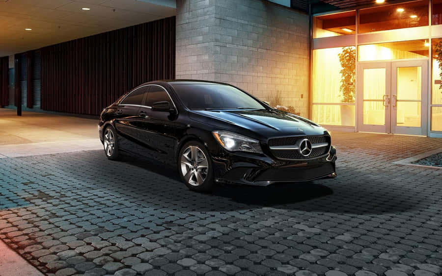 Sleek And Luxurious Mercedes Benz Cla-class In Motion Wallpaper