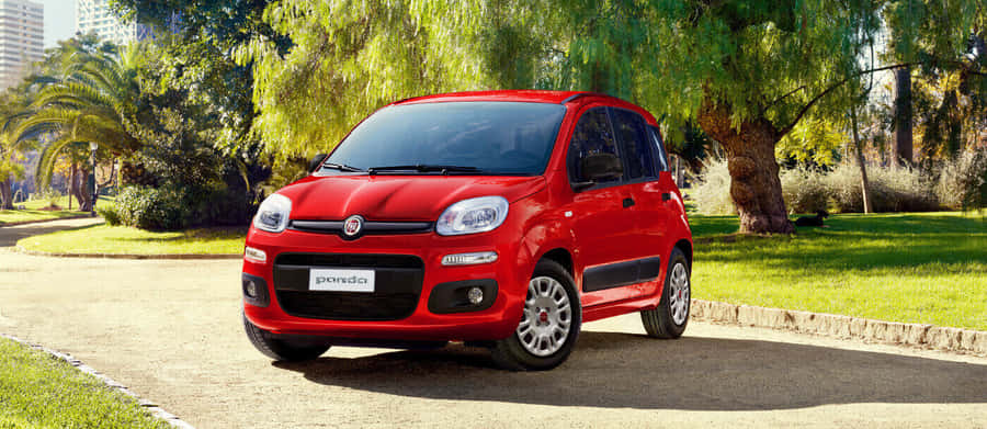 Sleek And Modern Fiat Panda In A Dynamic City Landscape Wallpaper