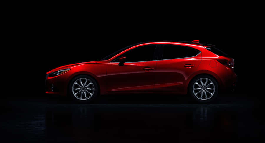 Sleek And Modern Mazda 3 Hatchback On The Road Wallpaper
