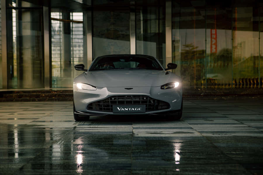 Sleek And Powerful Aston Martin Vantage On The Road Wallpaper