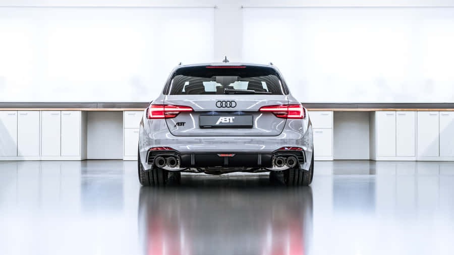 Sleek And Powerful Audi Rs4 In Action Wallpaper
