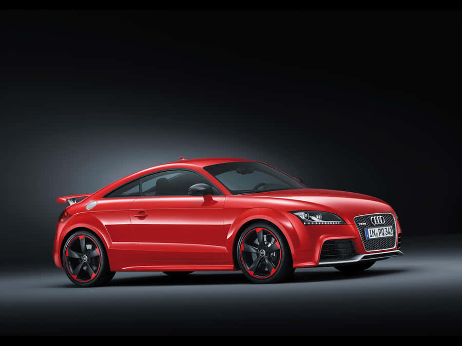 Sleek And Powerful Audi Tt Rs On The Road Wallpaper