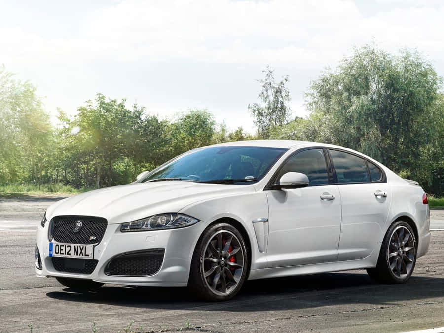 Sleek And Powerful Jaguar Xfr In Action Wallpaper