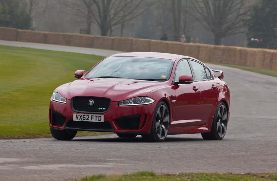 Sleek And Powerful Jaguar Xfr In Action Wallpaper