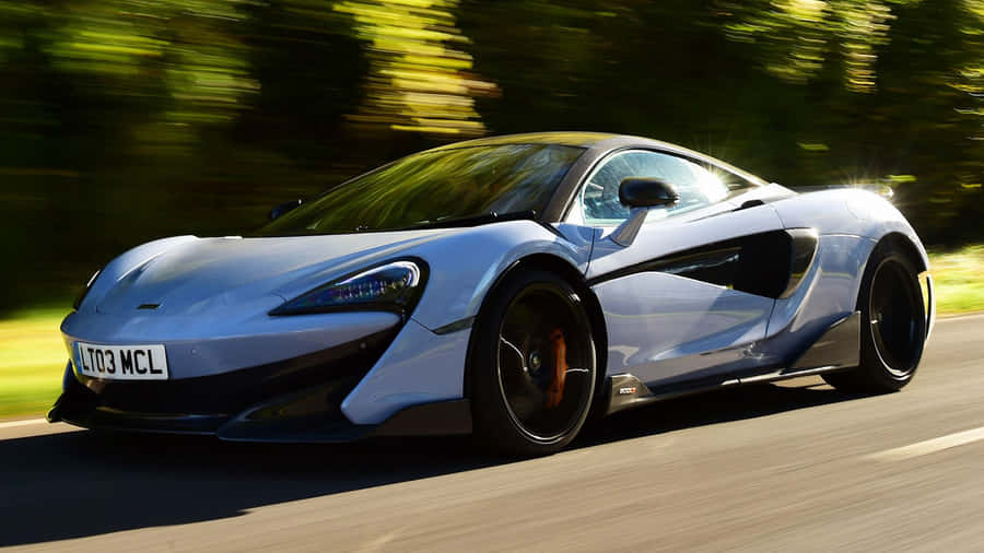 Sleek And Powerful Mclaren 600lt In Action Wallpaper