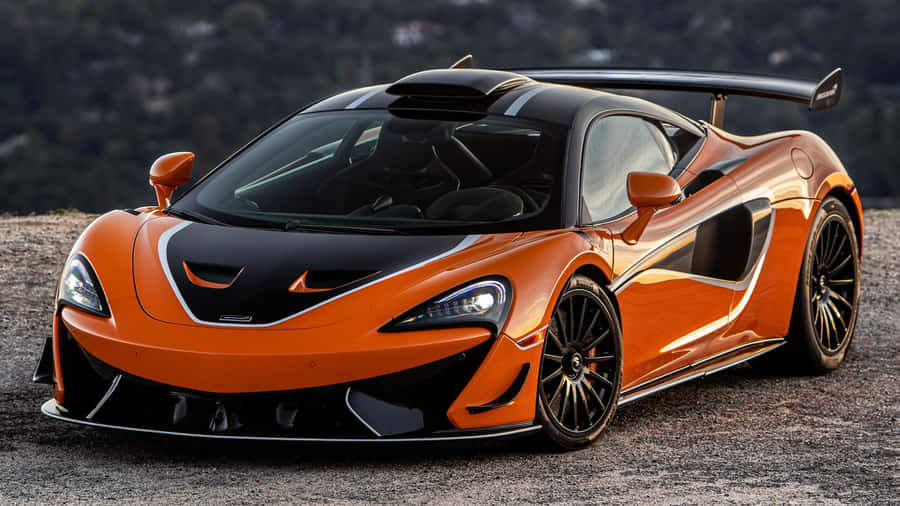 Sleek And Powerful Mclaren 620r On The Road Wallpaper