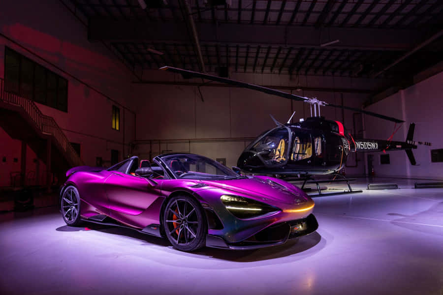 Sleek And Powerful Mclaren 765lt On The Open Road Wallpaper