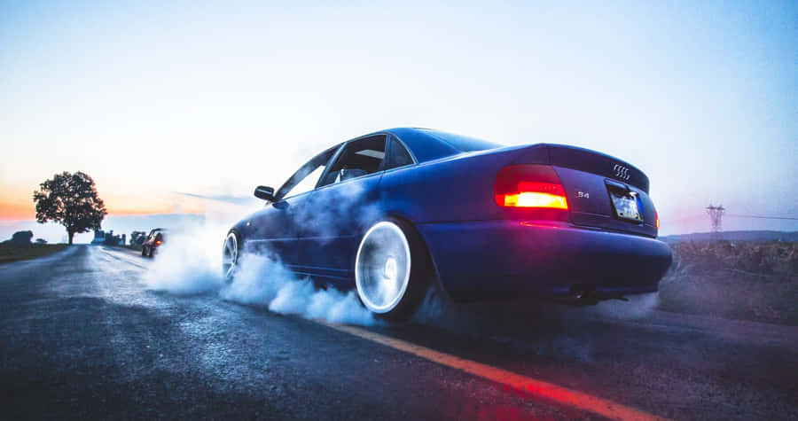 Sleek And Sophisticated Audi A4 In Action Wallpaper