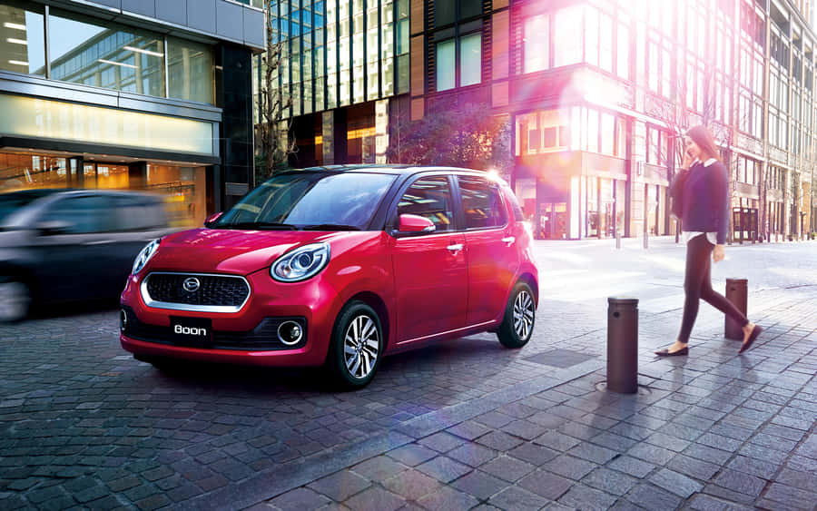 Sleek And Sophisticated Daihatsu Sirion On The Road Wallpaper