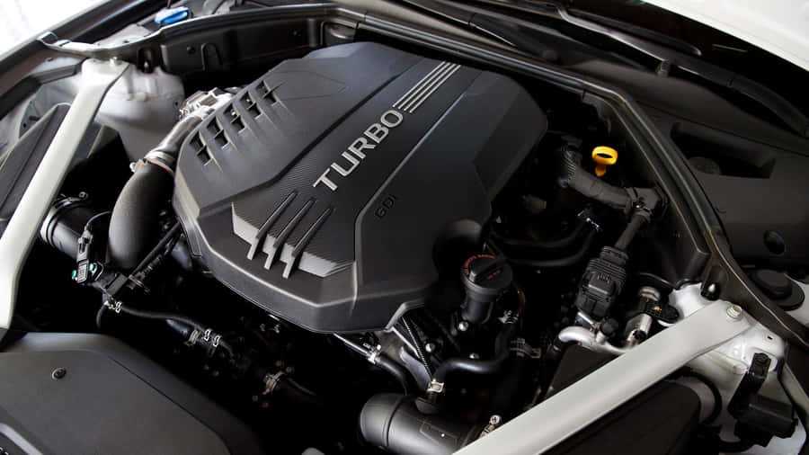 Sleek And Sophisticated Genesis G70 Luxury Sedan On The Road Wallpaper