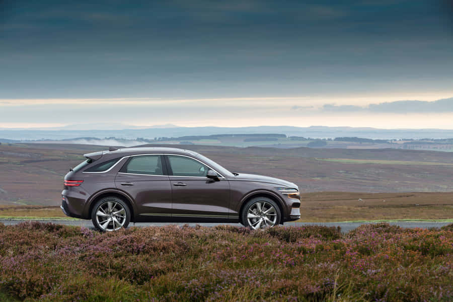 Sleek And Sophisticated Genesis Gv70 Suv Wallpaper