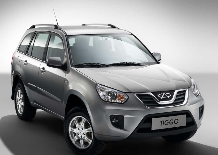 Sleek And Stunning Red Chery Car Wallpaper