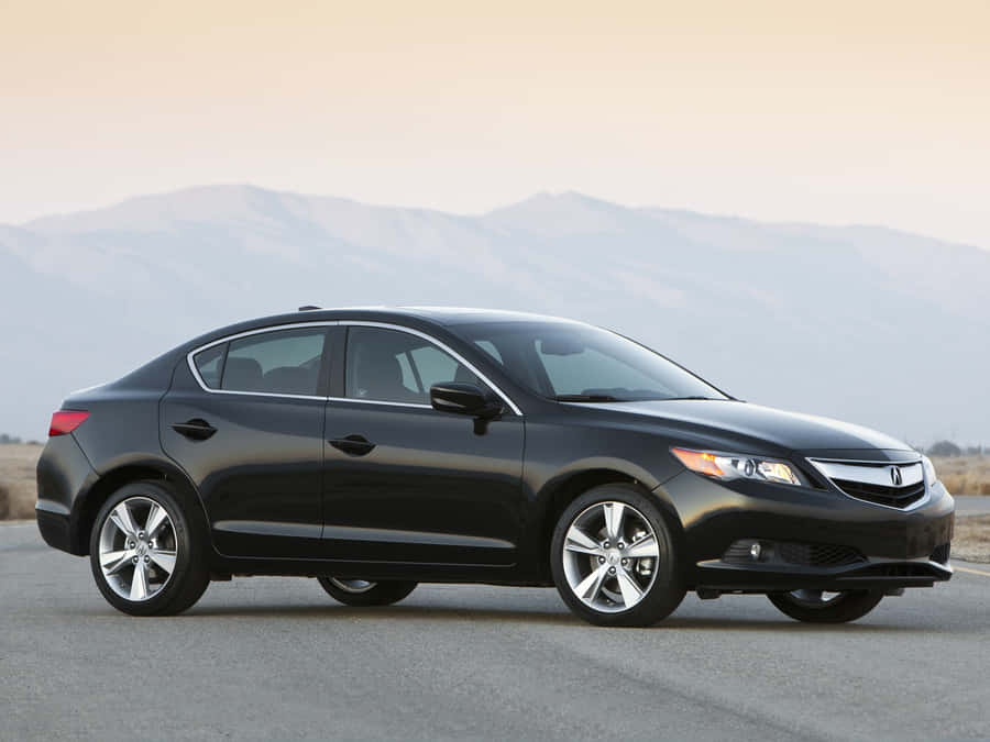 Sleek And Stylish Acura Ilx On The Road Wallpaper