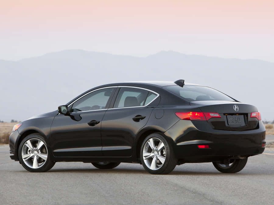 Sleek And Stylish Acura Ilx On The Road Wallpaper