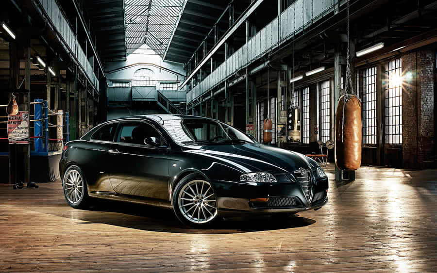 Sleek And Stylish Alfa Romeo Gt On The Street Wallpaper
