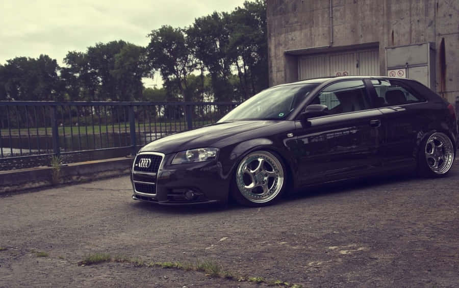 Sleek And Stylish Audi A3 On A Scenic Drive Wallpaper