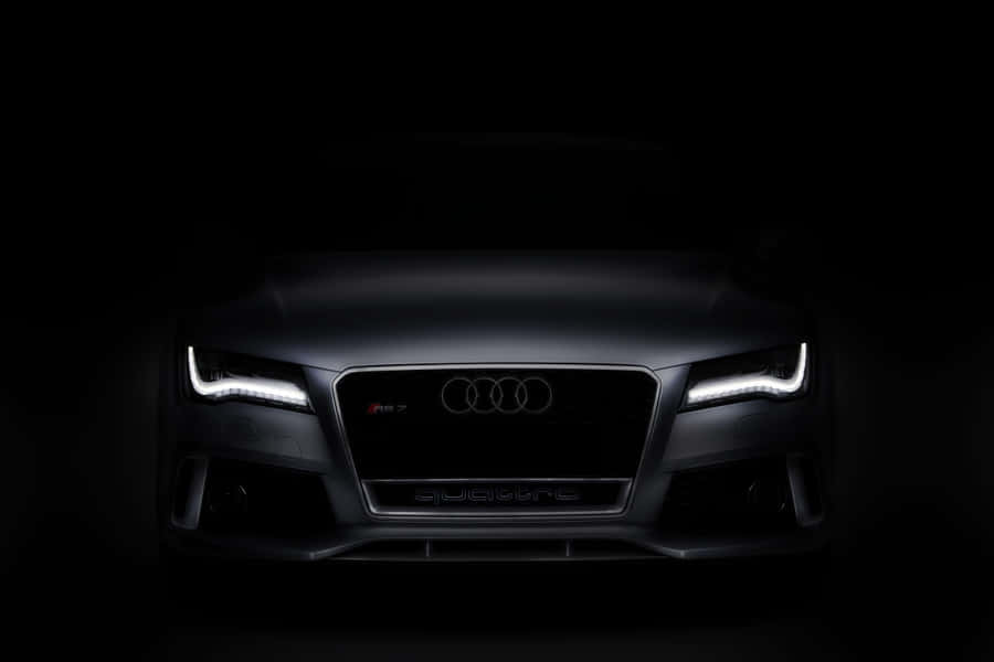 Sleek And Stylish Audi A4 On The Road Wallpaper