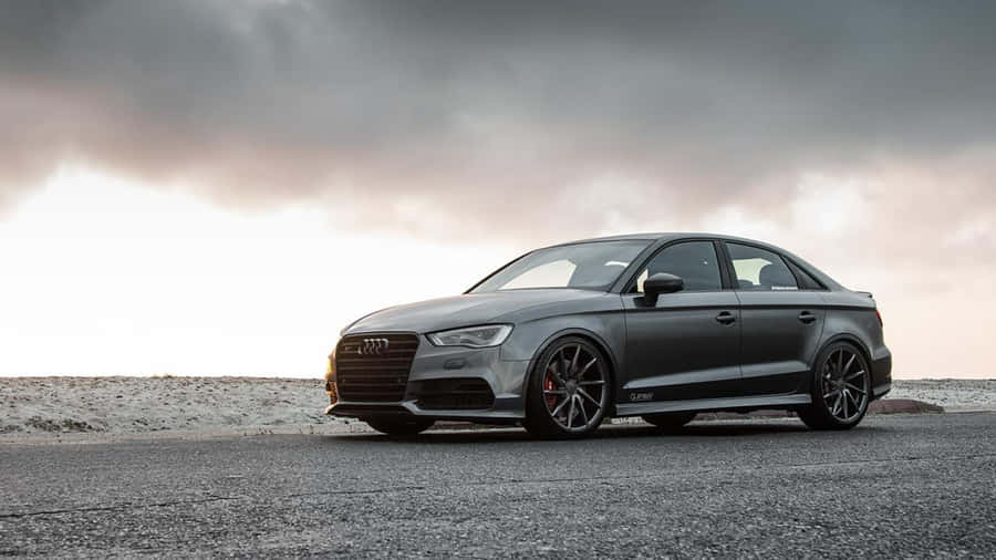 Sleek And Stylish Audi S3 On The Road Wallpaper